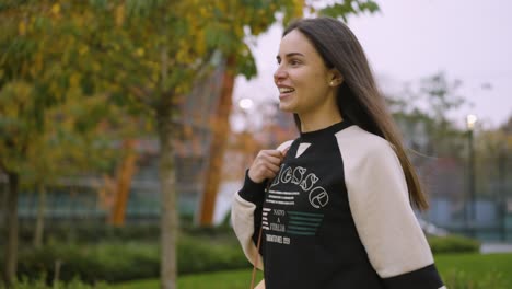 a woman relaxed and smiling after her yoga session.