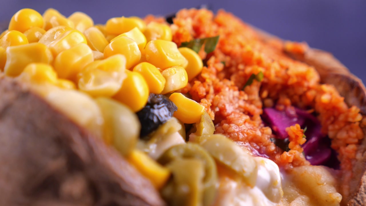 Close-up of a Delicious Baked Potato (Kumpir) with Various Toppings