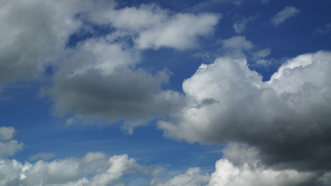 Cumulonimbus Clouds Moving Across Against A Blue Sky. Timelapse 30x.
