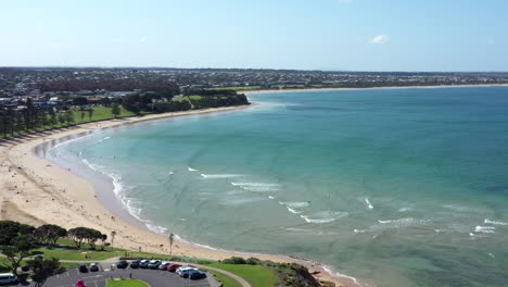 aerial over front beach, torquay australia on a sunny day