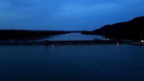 silhouette of hydroelectric power station on the danube river in the evening in greifenstein, hesse, germany