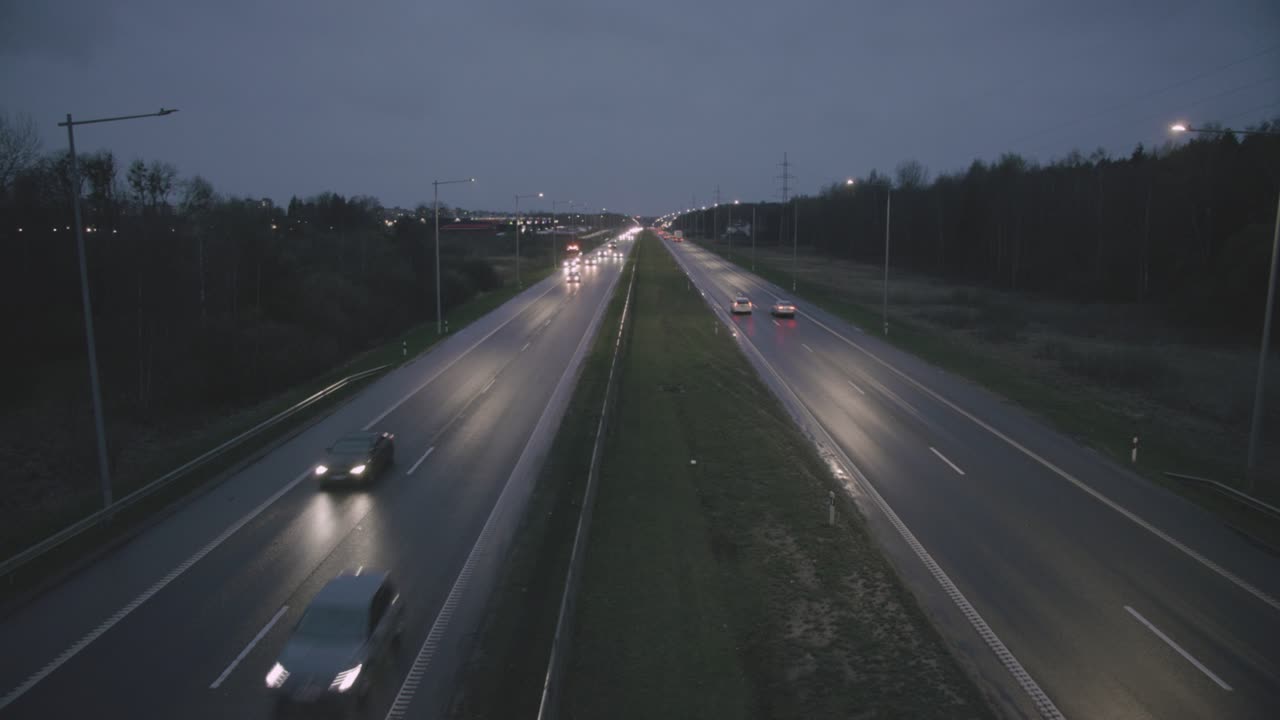 Cars in city bypass at night
