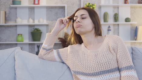 Sad-looking-pensive-young-woman-suffers-from-depression-at-home-alone.