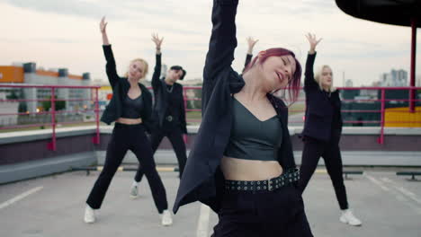Red-haired-group-leader-dancing-and-her-group-follow-her