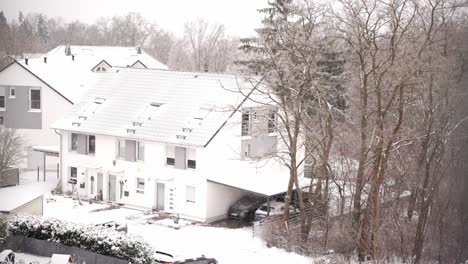 snowed-in house during light snowfall