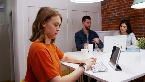 Female-executive-working-at-desk