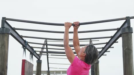 Caucasian-woman-exercising-at-bootcamp