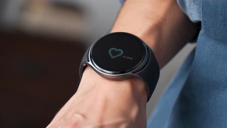 close-up of a smartwatch monitoring heart rate on a person's wrist