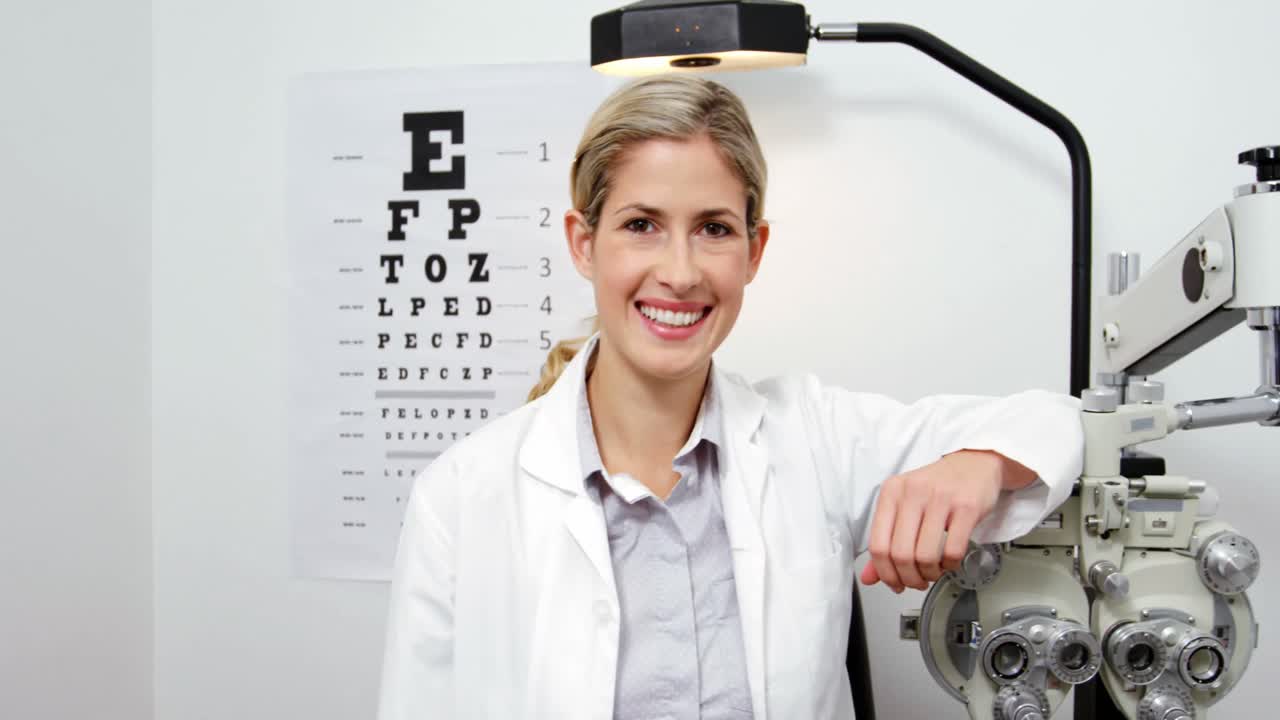 Beautiful optometrist standing in ophthalmology clinic
