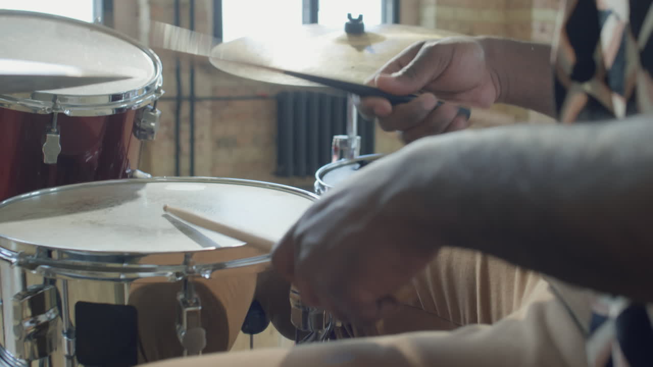 African American Musician Playing Drums in Studio