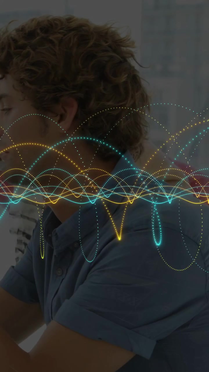 Vertical video: Man at desk leaning, audio-triggered waveform overlaying him showing business data