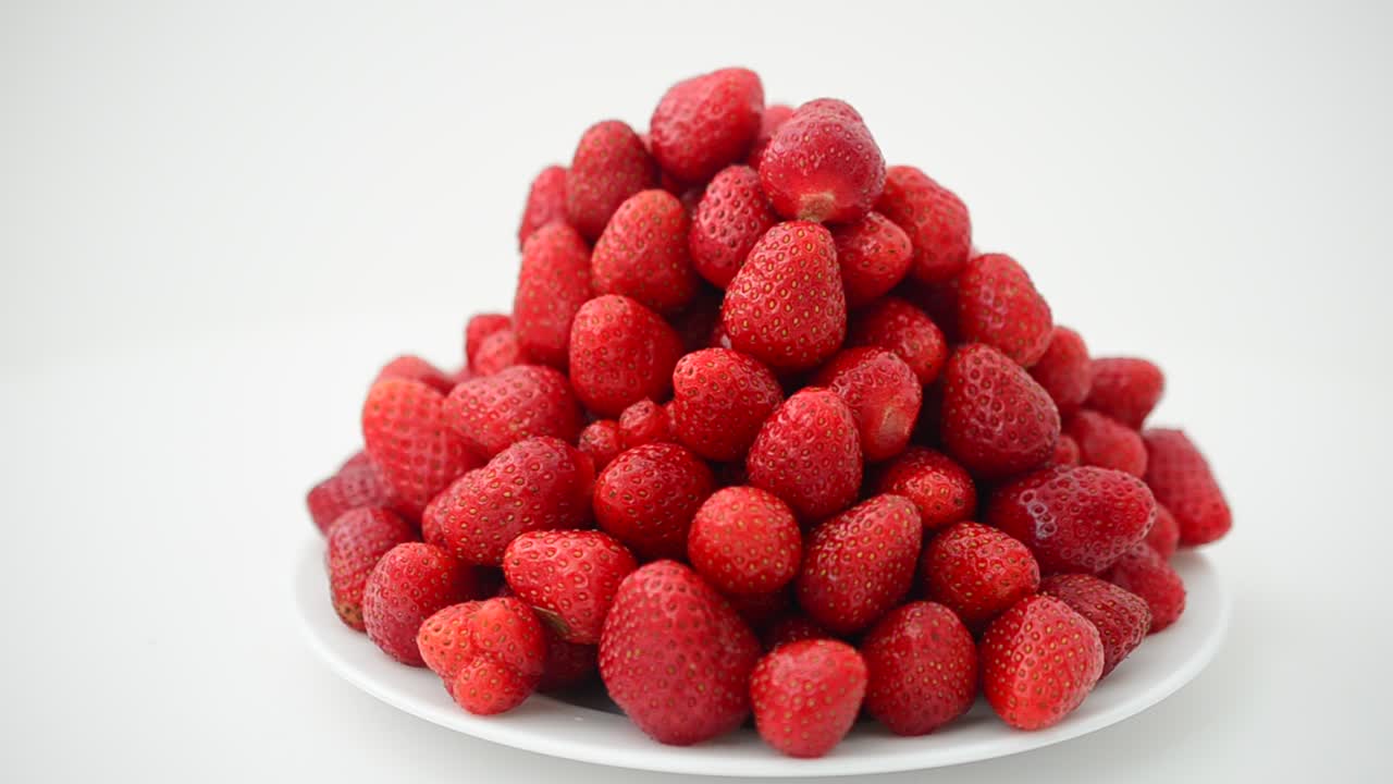 Strawberry on a white background, isolate. Shooting in the movement
