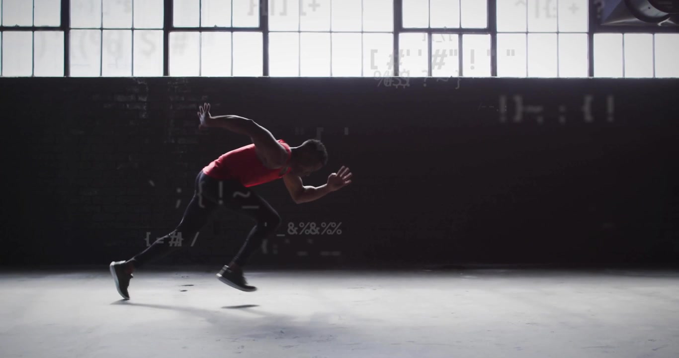 Male sprinter crouching on concrete floor with drifting code driving sprint in sports tech demo