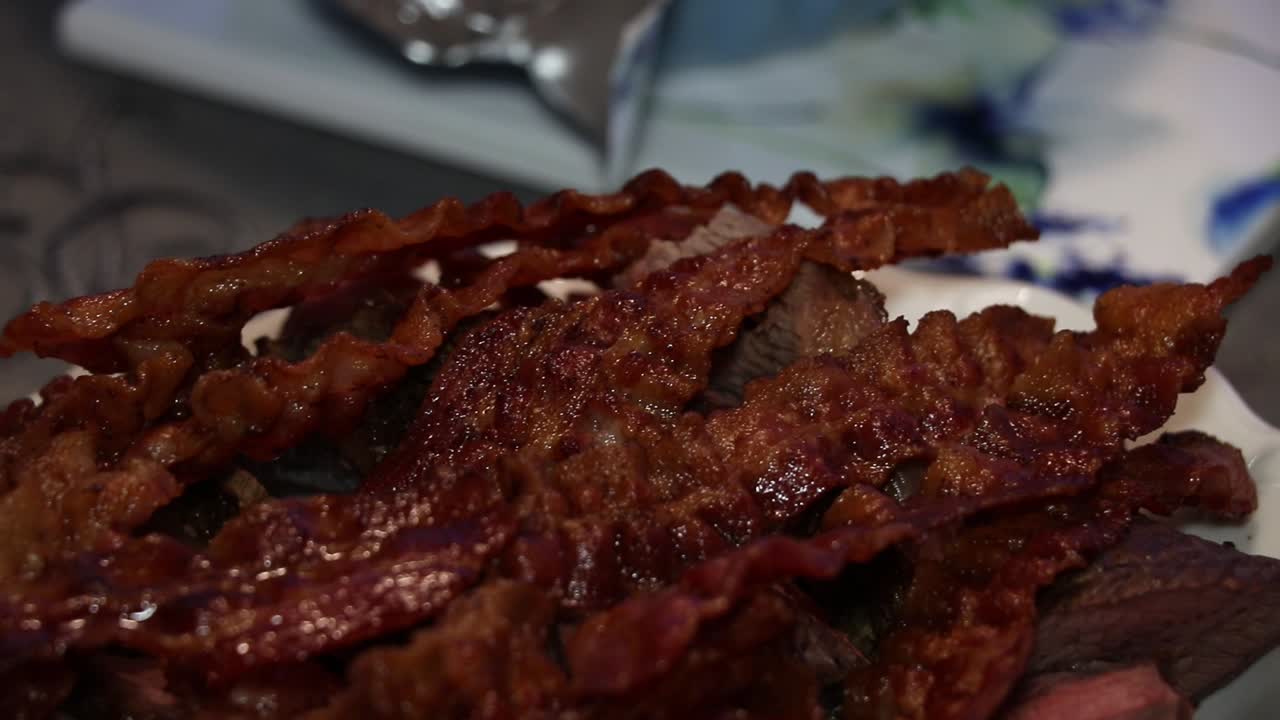 Moving shot of a pile of bacon