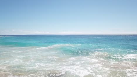 hawaii aerial drone view right to left camera pan flyby of beach