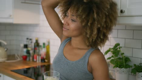 woman drinking fresh water at home