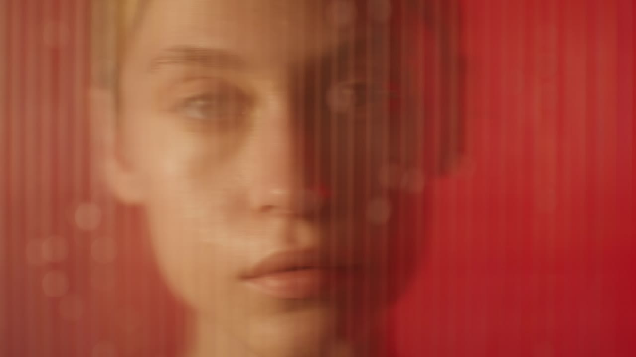 Woman Behind a Red Screen
