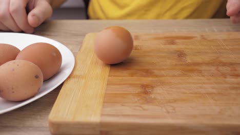 boiled eggs, slicing and preparing eggs for making olivier salad, salad making concept