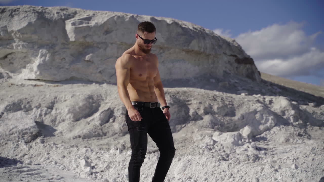 Handsome fit man posing outdoors. Topless handsome healthy athletic man with muscular body