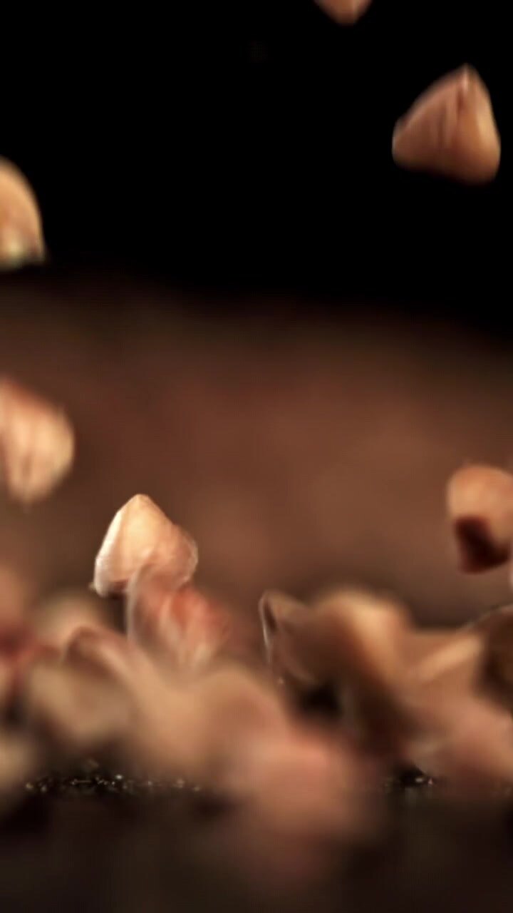 Buckwheat Groats Falling and Bouncing in Slow Motion