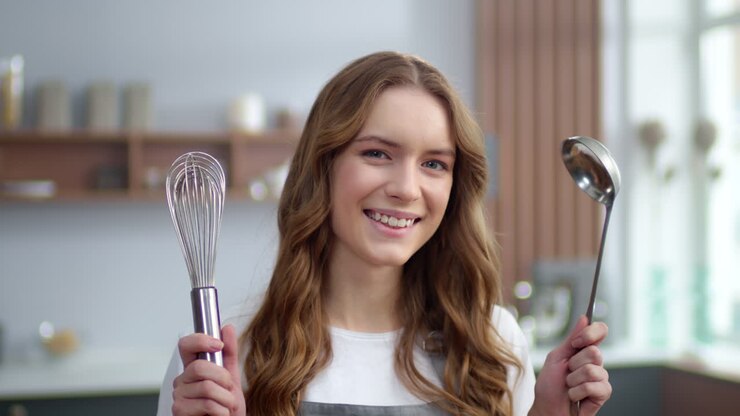 Woman preparing for cooking in the kitchen