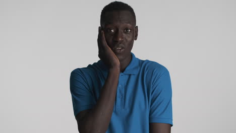 Surprised-African-american-man-on-grey-background.