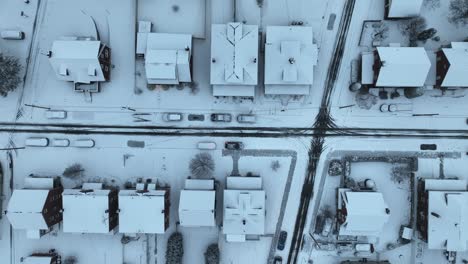 snow-covered homes and houses in american suburb at winter snow