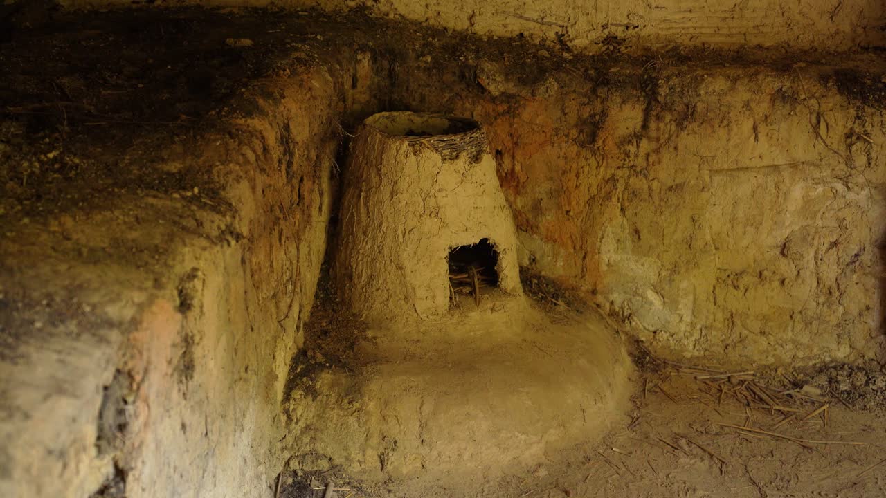 Interior clay oven structure in ancient earthen house