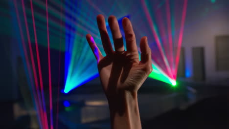 hand in front of laser lights