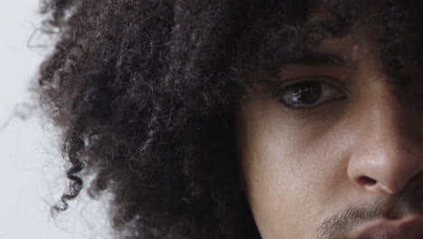 close-up-mixed-race-man-eye-looking-at-camera-serious-expression