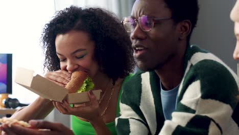 three friends eating at home