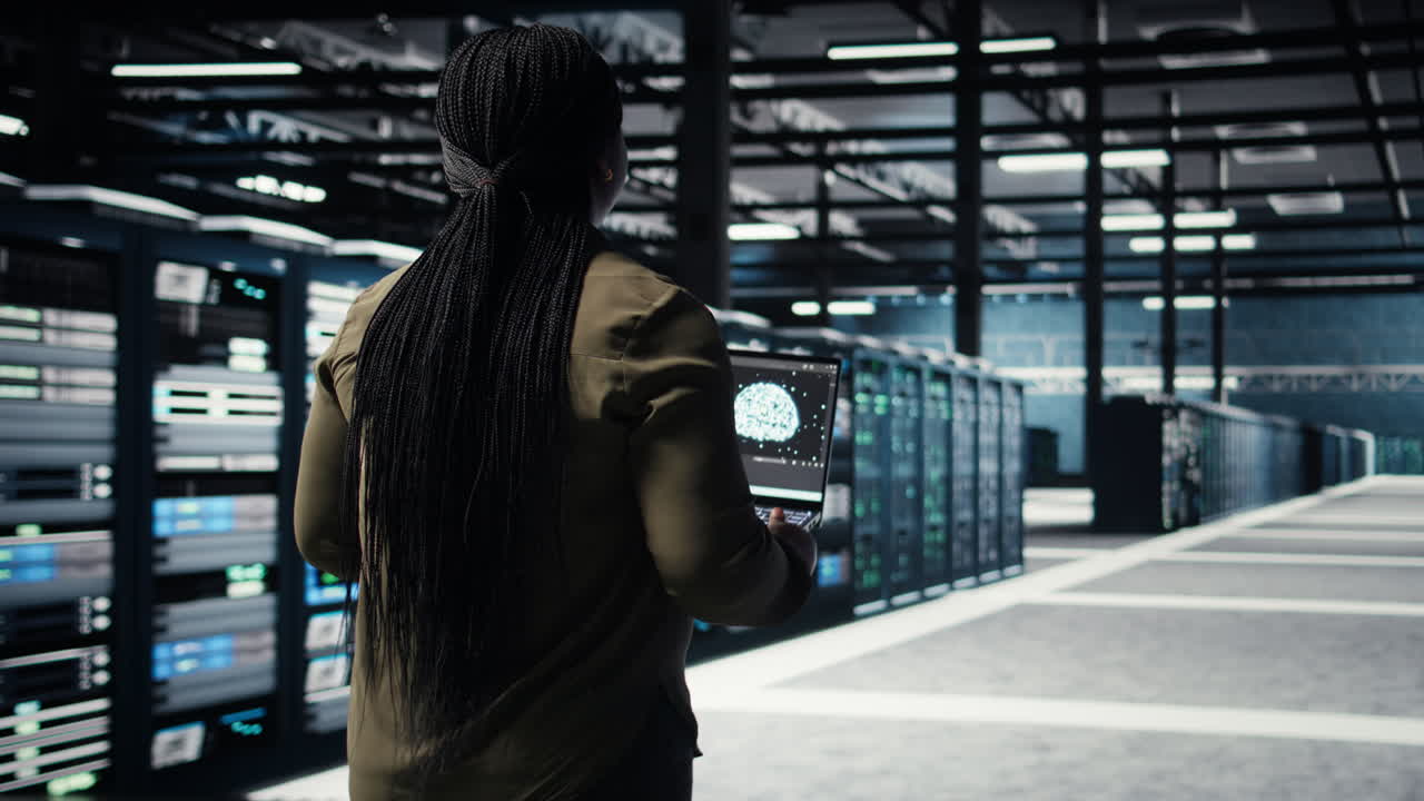 Data center engineer using deep learning on laptop to optimize operations