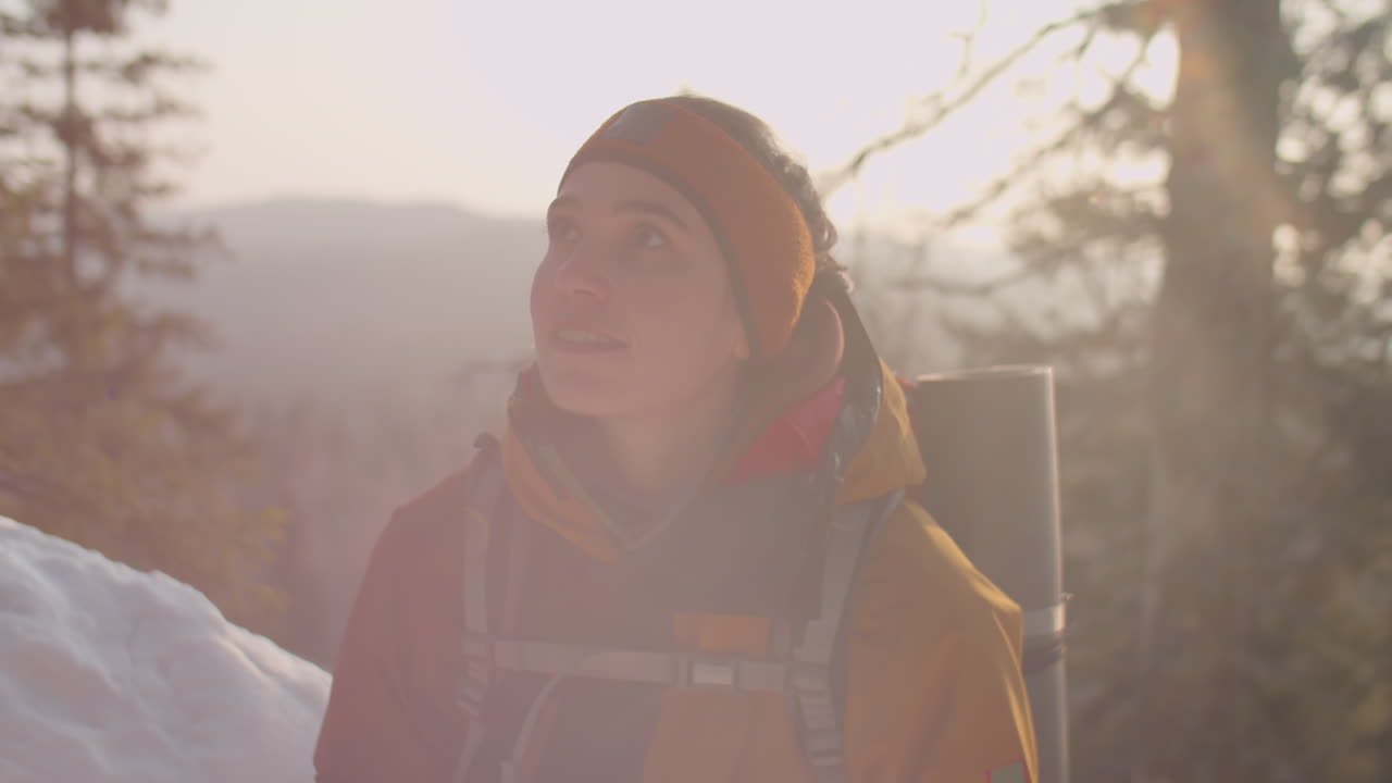 Woman Standing in Mountains and Enjoying Winter Nature
