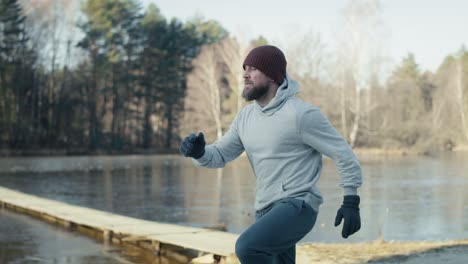 adult caucasian man chatting warming up before winter swimming.