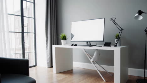 modern home office setup with computer and electronic devices