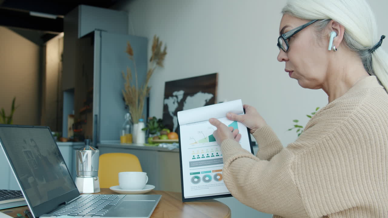 Business Woman in Video Conference, Presenting Data