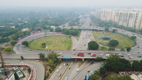 aerial drone shot capturing the dense traffic on delhi’s flyovers, with vehicles moving in multiple lanes during rush hour.