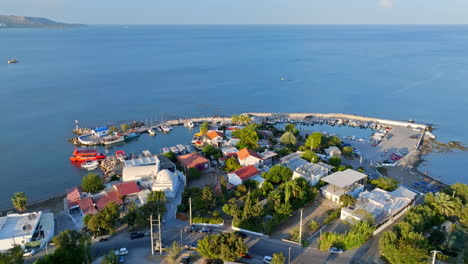 aerial view backwards over the faliraki harbor, golden hour in rhodes, greece