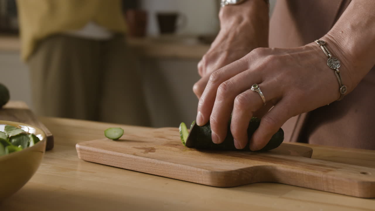 Cutting cucumber for salad