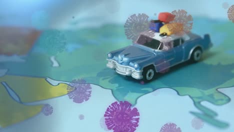 animación de células macro covid-19 flotando sobre un mapa del mundo con un juguete de coche de pie en asia