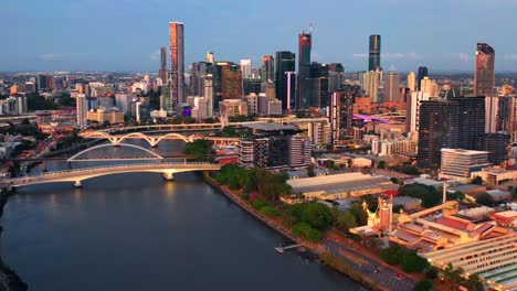 aerial view of brisbane city south bank and cbd from toowong suburb during golden hour sunset