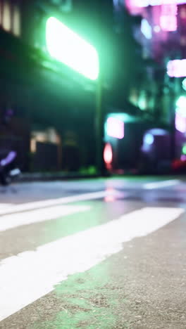 blurry night city street with crosswalk