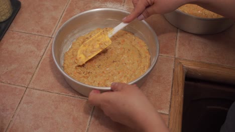 puting carrot cake batter on plate for baking