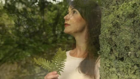 woman smelling a leaf