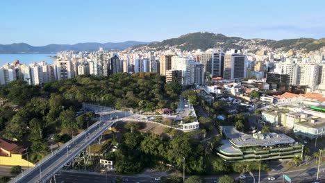 drone aerial scene of hercílio luz bridge and parque da luz with large urban center of the capital of santa catarina architecture and urbanism in capitals with urban fabric vehicle traffic on roads