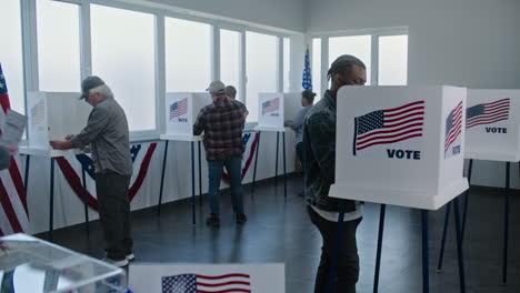 people voting in a polling station