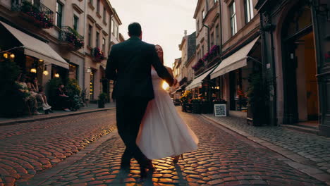 romantic couple dancing in the city at sunset