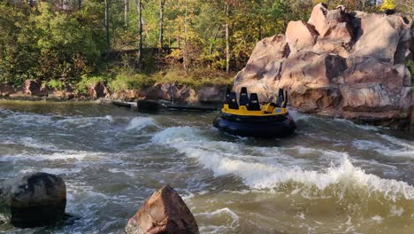 a view of an empty ride of donnerfluss running with the fast waves of the lake hitting by stones, holidaypark