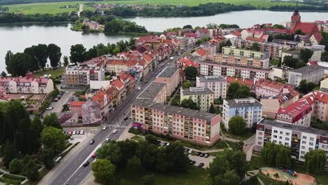 Downtown-of-Elk-city-and-castle-island-in-background,-aerial-view