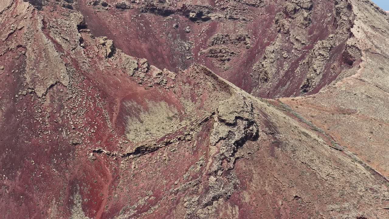 Rugged Volcanic Crater Of Volcan de la Corona At Timanfaya National Park In Lanzarote, Spains. closeup, drone shot